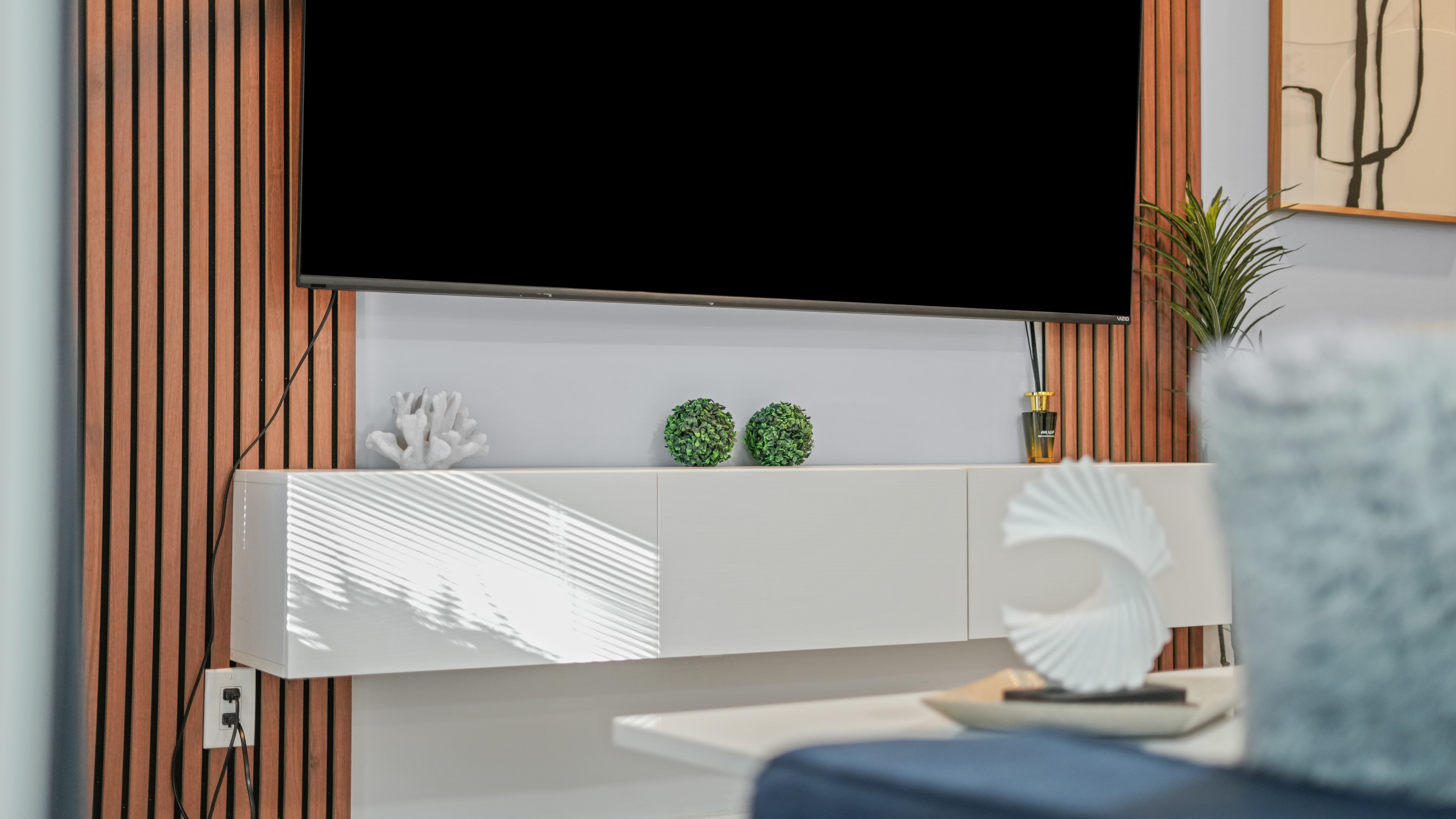 Detail shot of outdoor patio with blue chairs and potted plant